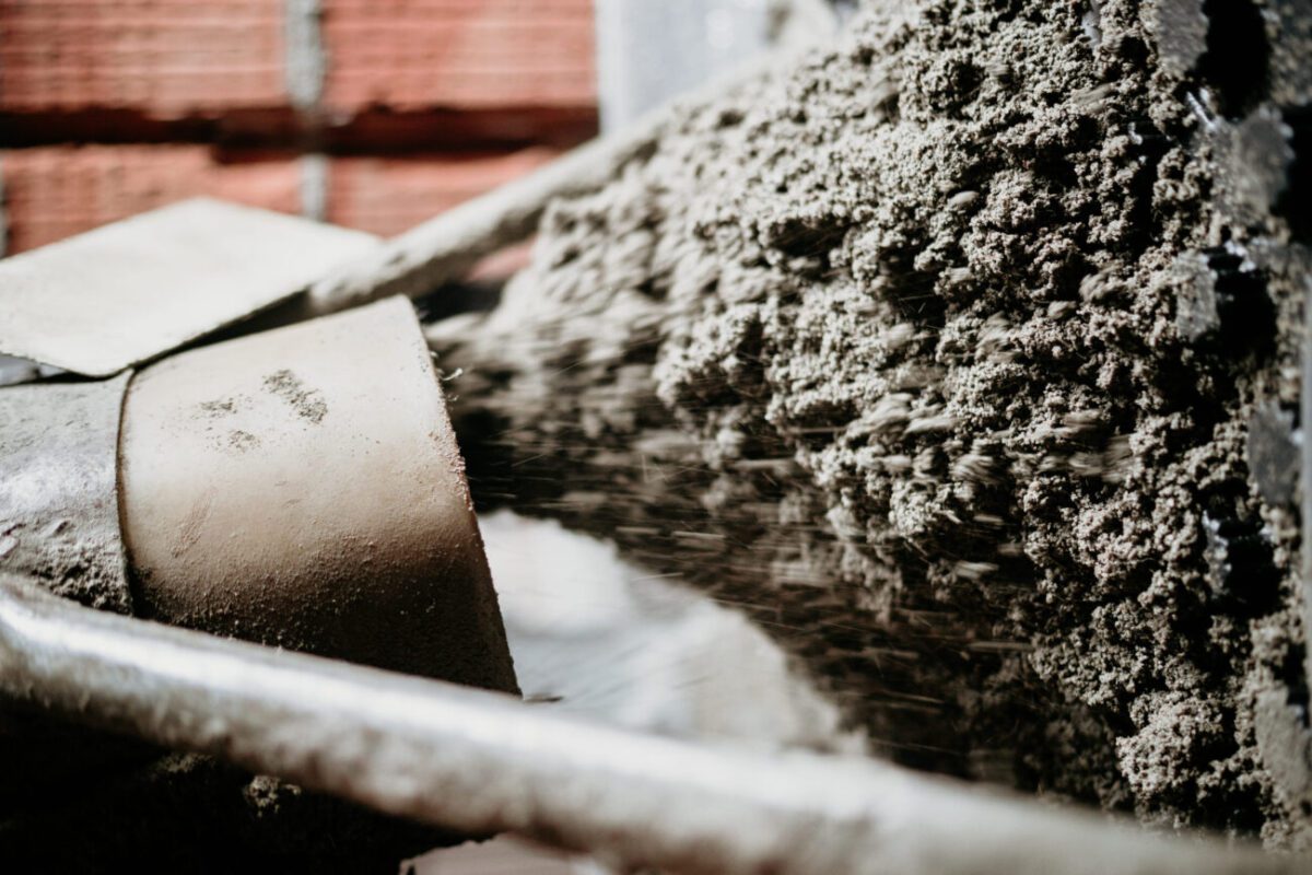concrete pump close up details Sand and cement floor screed | diario-economia.com Close-up of a cement mixer pouring wet concrete into a trench beside a brick wall at a construction site.