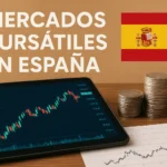 Spain stock markets: tablet with rising chart, coins, and a line graph on paper beside the Spanish flag and heading "Mercados bursátiles en España"